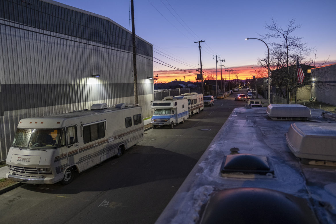 Dusk falls on seven vehicular homes at Eighth and Harrison streets in Berkeley’s Gilman District. For over a year, a vehicular community called Friends on Wheels has found refuge at this intersection, living together for safety and companionship. While searching for safe parking spots and the amenities of everyday life, vehicular residents met and banded together at the Berkeley Marina. But as the community of vehicle dwellers grew, their risk of being towed and receiving further citations forced people to leave. Vehicle residents had to find another safe place to settle, and so they found a resting spot on the industrialized streets of West Berkeley.