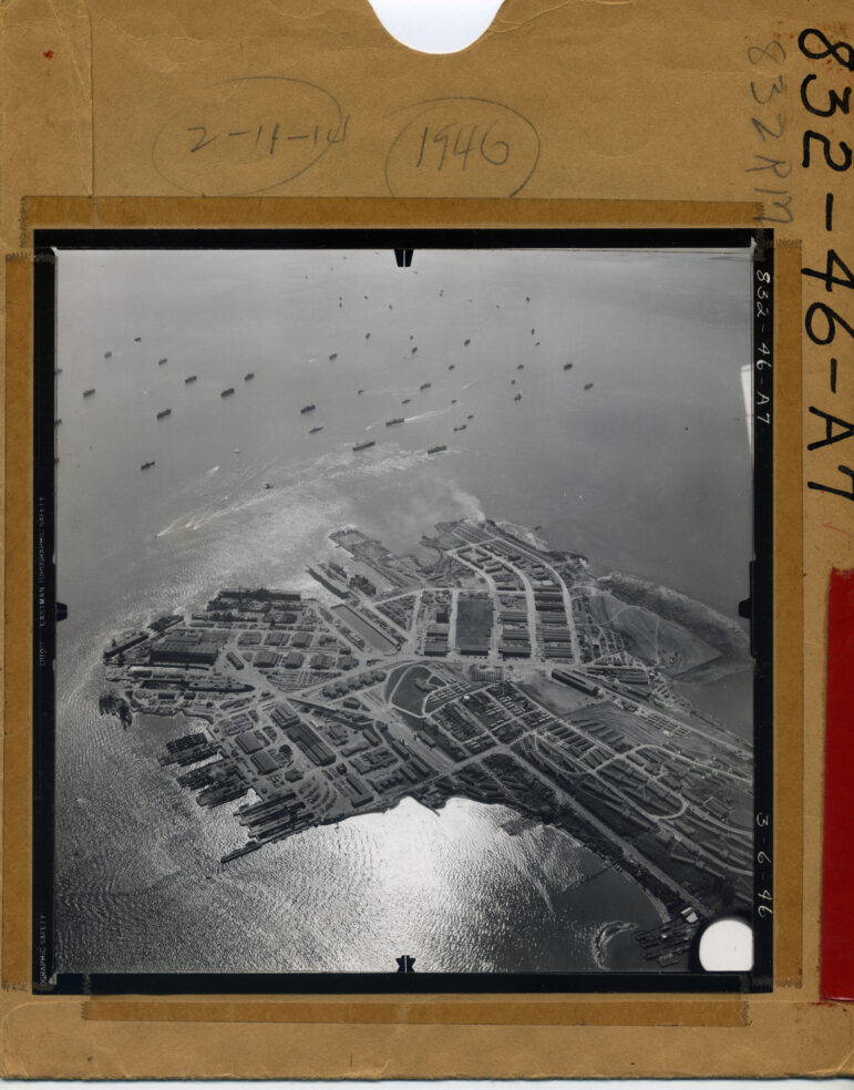 A black-and-white aerial photo of the Hunters Point shipyard in San Francisco Bay