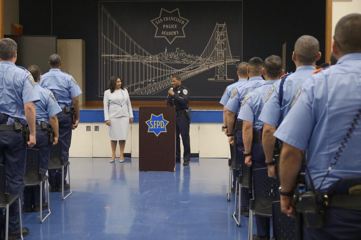 Mayor London Breed and Police Chief Bill Scott address cadets at the police academy.